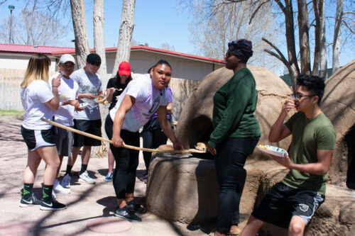 casa students cooking at the horno